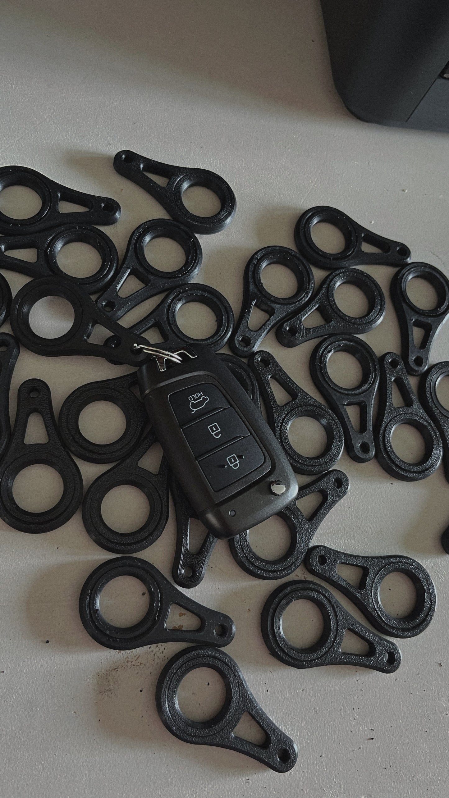 Llavero, antiestrés ergonómico